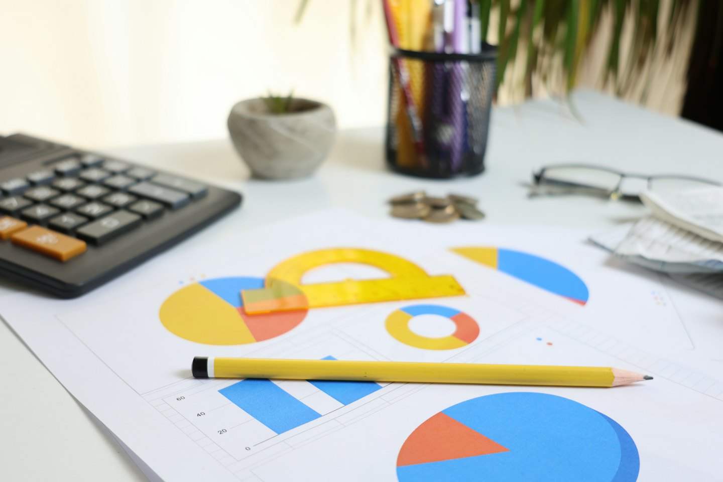 Desk with financial documents and office supplies for planning.